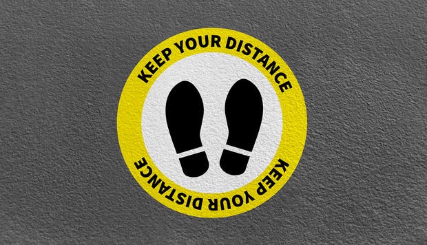 A range of social distancing print solutions that includes floor stickers